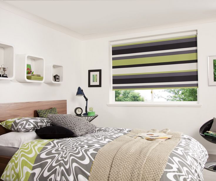 Vibrant and cozy bedroom design featuring custom made and durable green stripes Roller/Holland Blinds covering the room's window. Installed by Shutter Up Brisbane.