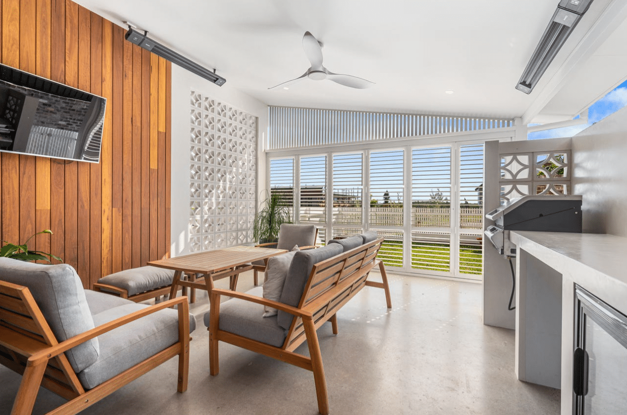 Functional Outdoor Aluminium Shutters installed in home living room with cosy and chilly vibe, available at Shutterup.