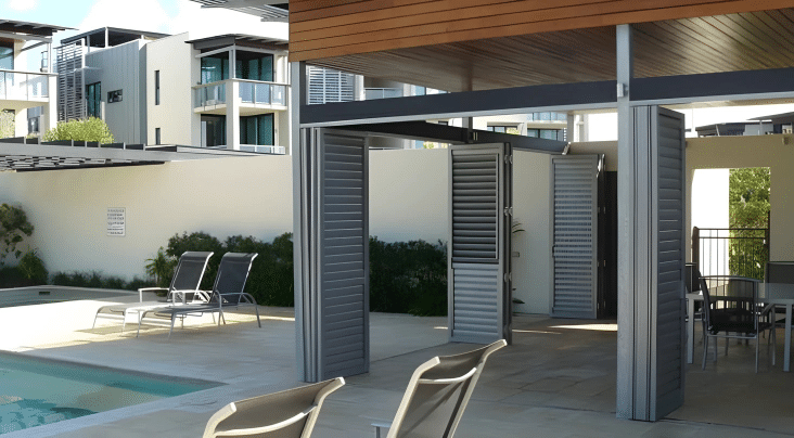Aluminium outdoor shutters shading a Brisbane patio while allowing airflow