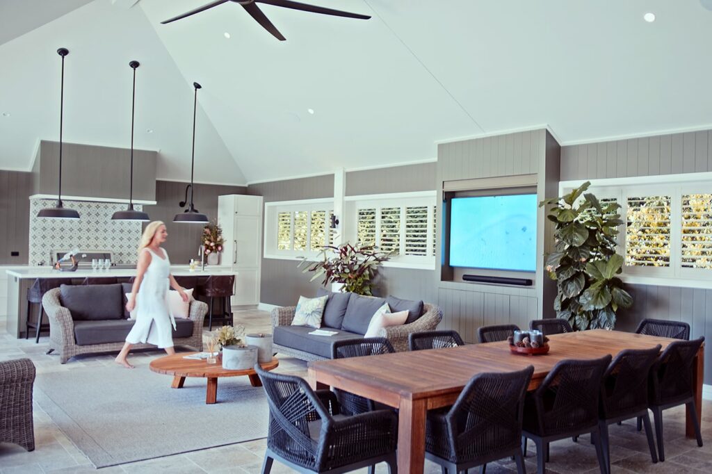 Outdoor shutters tilted upward for privacy and breeze on a Brisbane balcony