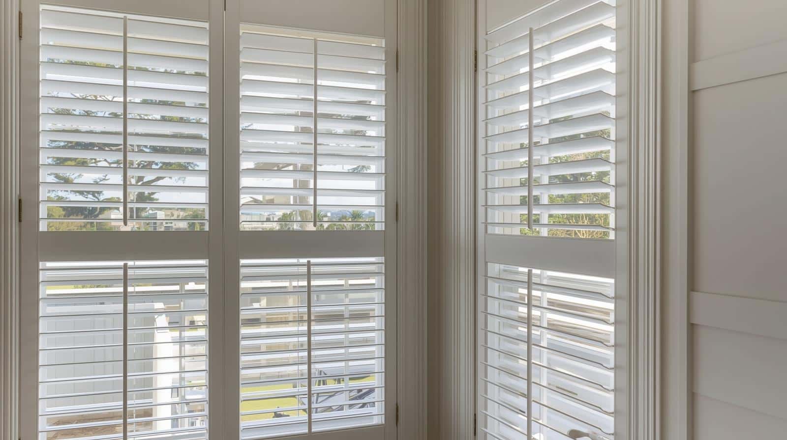 White plantation shutters in Brisbane home with adjustable louvres for light and privacy control