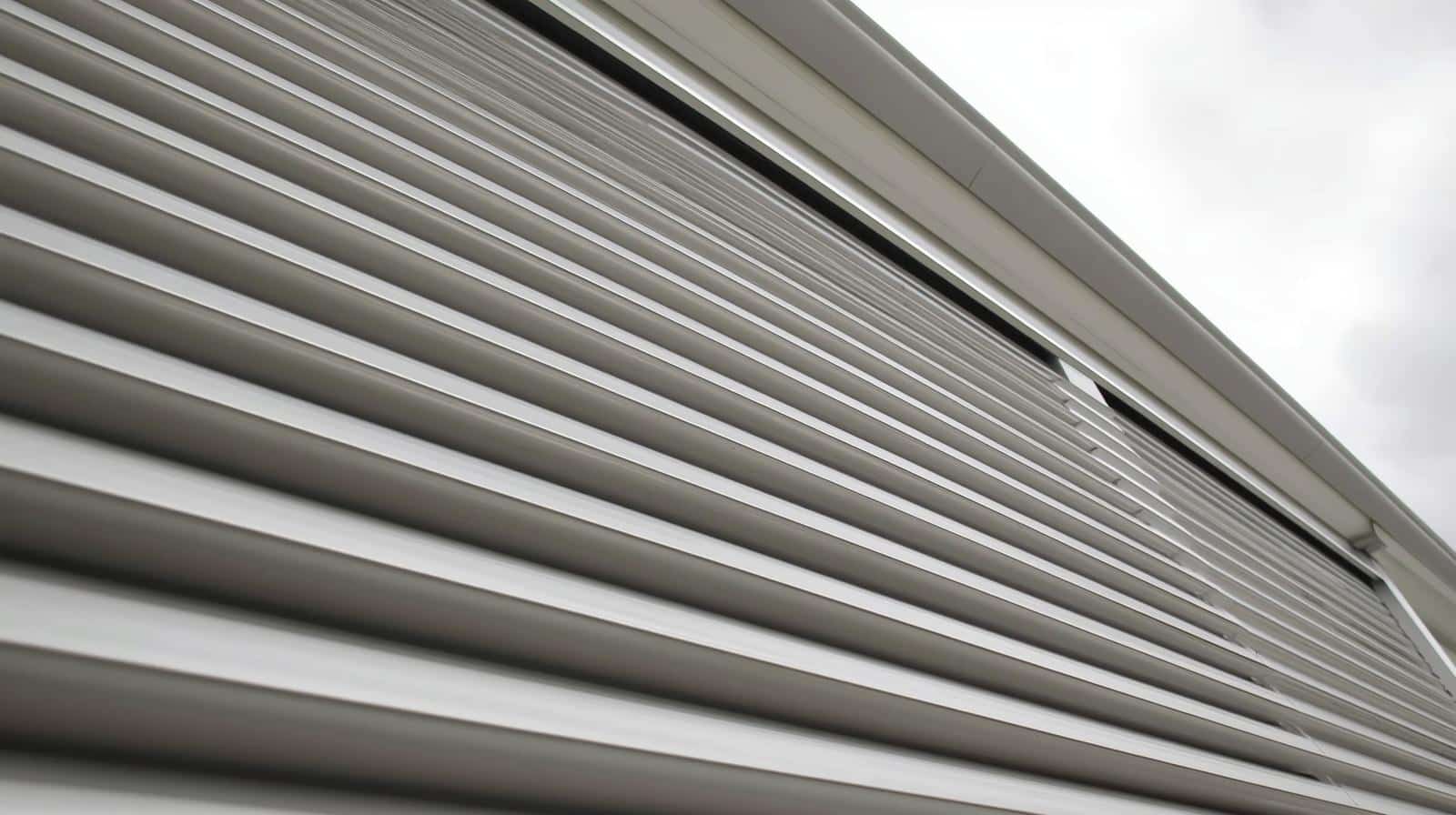 aluminium external shutters on Queensland coastal home providing security and cyclone protection