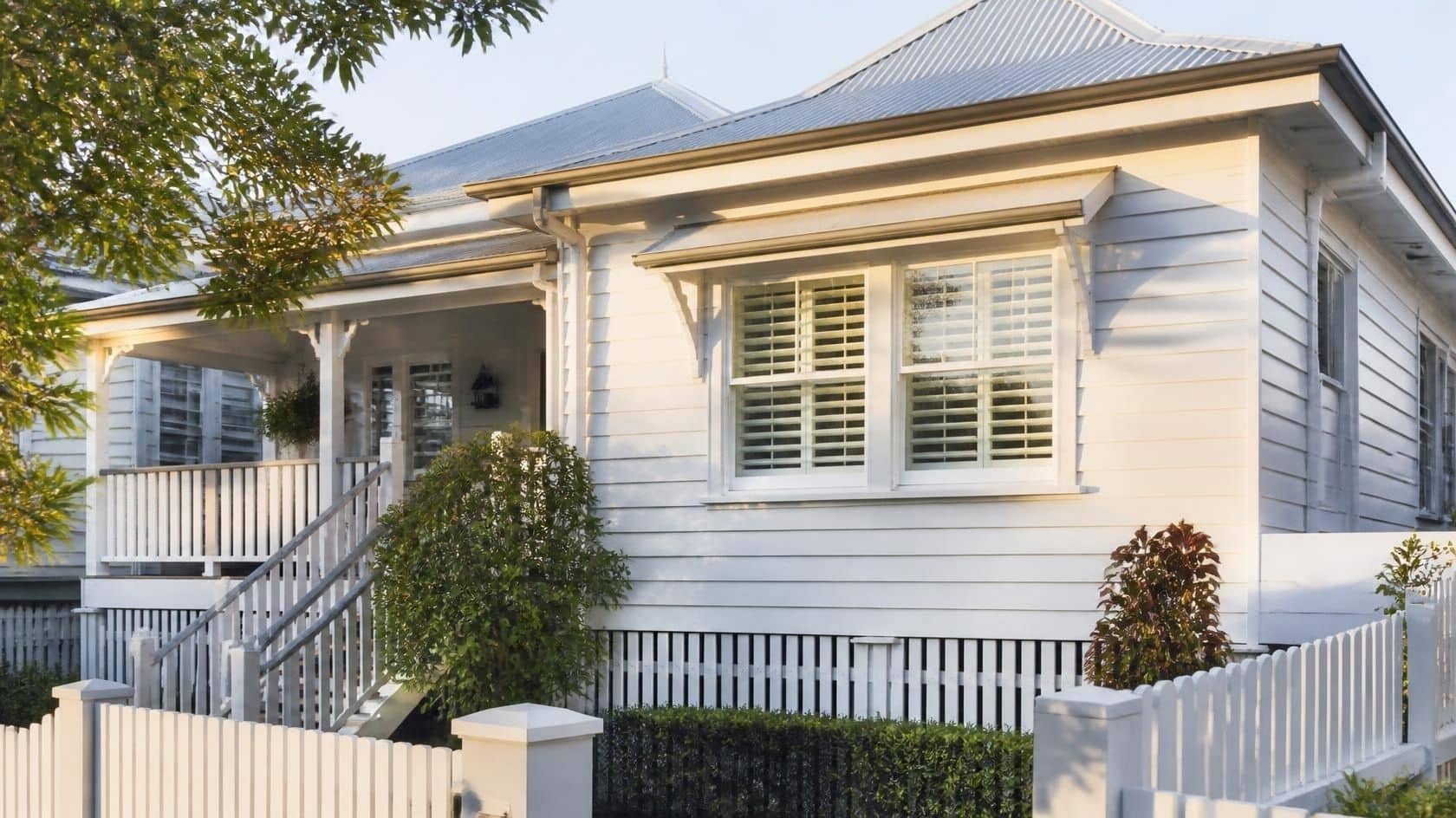 Traditional Queenslander home with matching aluminium plantation shutters